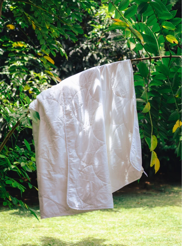 A Larke duvet drying outdoors on a washing line